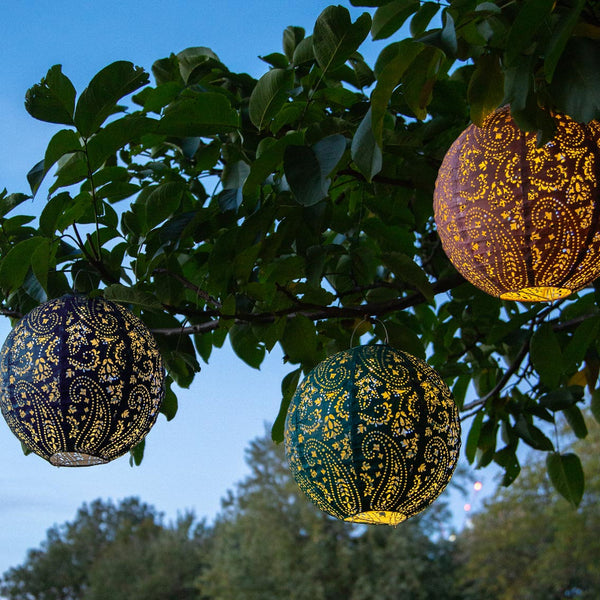 3 Solar lanterns hanging in the tree